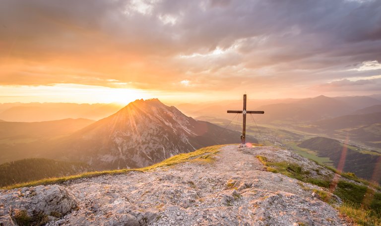 Summit cross of Stoderzinken in the morning sun